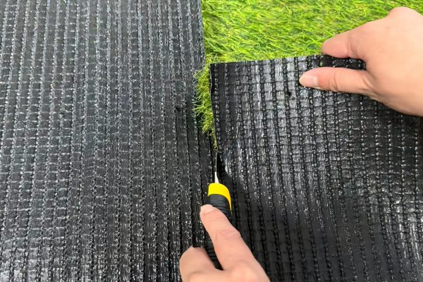 How do you cut artificial grass?