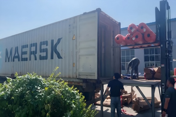 Rolls of high-quality artificial grass in a warehouse