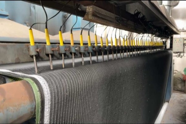 Close-up of artificial grass drainage holes