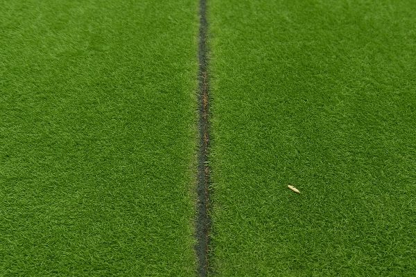 A visible seam in a poorly installed artificial grass lawn