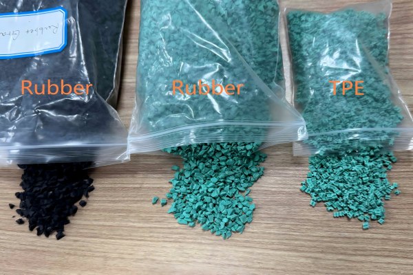 Different types and colors of turf infill pellets in separate piles