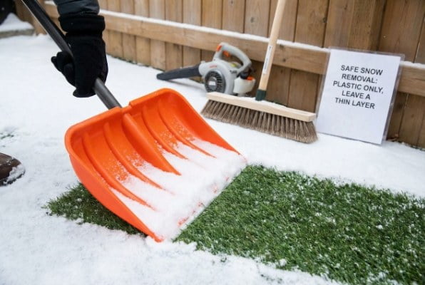 How do you remove snow from artificial turf