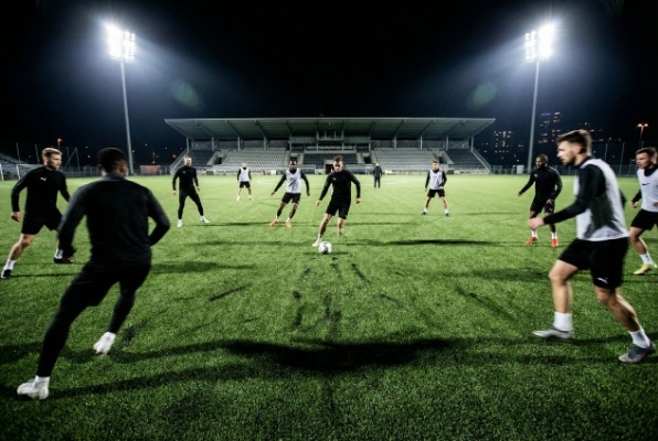 soccer players during night training on artificial turf